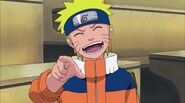 Naruto laughing after Kakashi falls for his prank.