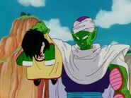 An unconscious Gohan with Piccolo