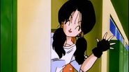 Videl waved her hand at Gohan with smile after school