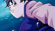 Videl is about to punch monster's belly to throw up and get Dragon Balls