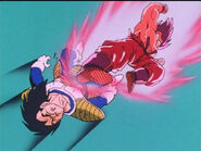 Vegeta gets kick in the back by Goku