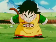 Kid Gohan is ready to power up against Raditz from hurting Goku