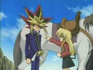 Yami Yugi being scolded by Rebecca for letting Yugi get capture
