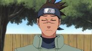 Iruka comments that the way Sasuke used his own clone to make Naruto hit his head on the Tree is very crude.