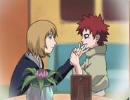 Gaara getting the blood off his uncle's finger.