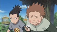 Choji eating food that they are suppose to bring to Yota.