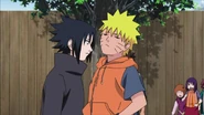 Sasuke ignores Naruto as he walks pass him.