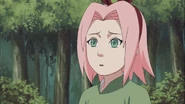 Sakura looking at Ino and her friends.
