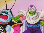 King Kai screams as Piccolo squeezes his shoulder too tight