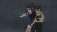 Sasuke protects Inari, while he tells Naruto to handle Gato's thugs.