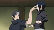 Sasuke getting his forehead poke by Itachi on the day that their whole clan would be murder.