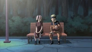 Sakura being cheered up by Naruto.