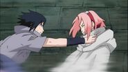 Sakura being grab by Sasuke.