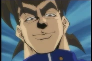 Decides to beat up Yugi for not giving him cash