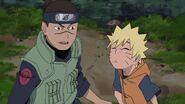 Iruka sees Naruto falling unconscious after he has found him, and three female rouge shinobi.