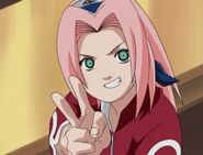 Sakura gives Ino a peace sign.