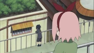 Sakura looking at Sasuke.