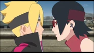 Boruto sees Sarada staring at him.