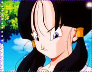 Videl looked down her high school badge after learning about the Gold Fighter