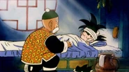 Grandpa Gohan helps Goku with his head injury.