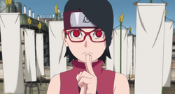 Sarada Uchiha (in her manga outfit), is unconscious