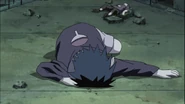 Sasuke falls unconscious as Itachi leaves him in Konoha.