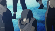 Itachi protecting an Infant Sasuke during the Kyuubi's attack on Konoha.