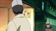 Naruto walks to the Ramen Ichiraku Bar.