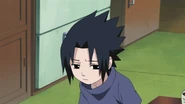 Sasuke becomes sad since Itachi can't play with him until he finishes his homework.