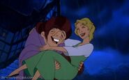 Quasimodo and Madellaine laughing while it's raining