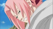 Sakura cries as she heals Karin.