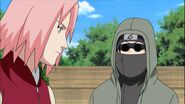 Sakura tells the Konoha 11 to leave Naruto to her.