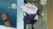 Kakashi pretends to fall for Naruto's prank.