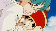 Gohan is hug tightly by Bulma as Raditz starts to walk toward them