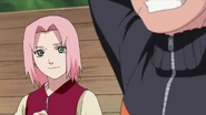 Sakura sicently thanks Naruto for not having anymore allies mention Sasuke's name in front of Team Kakashi.