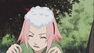 Sakura being hit with a snowball by Ino.
