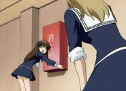 Tohru tells Arisa that her head hurts really bad since she hit her head on the fire Extinguisher box.