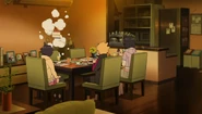 Naruto's shadow clone disappears as he drops Himawari's cake on the table.
