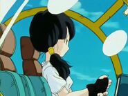 Videl flying with her jet helicopter over to Gohan's house