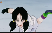 Videl is about to make a swift kick at the Red Shark Gang's leader