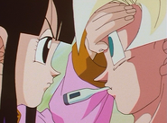 Goku as Chi-Chi checks to she if he has a fever, after agreeing with her about Gohan studying.