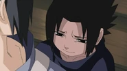 Sasuke with a sad look on his face.