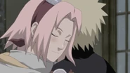 Sakura hugs Naruto; in order for him to forget about his promise to bring Sasuke back to Konoha.