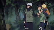 Iruka is wished good luck by Kakashi on looking after Naruto in the Ninja Academy.