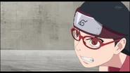 Sarada about to defeat her opponent.