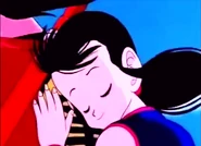 Chi-Chi lays on Goku's back