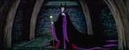 Maleficent about to show the horrified fairies Aurora's unconscious body after she had pricked her finger on a spindle.