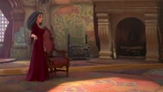 Gothel about to sit down on a chair.