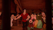 Gaston celebrating, believing his plan will work.