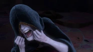 Gothel covering herself with her cloak as she ages.